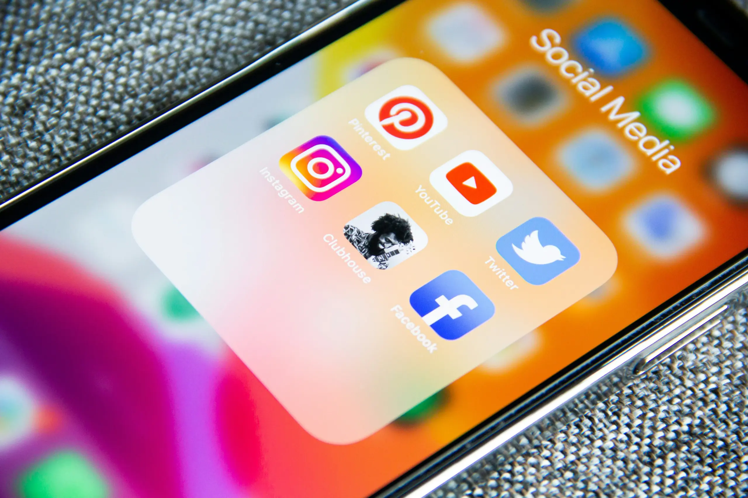 Push strategy marketing through social media apps on smartphone including Instagram, YouTube, and Facebook