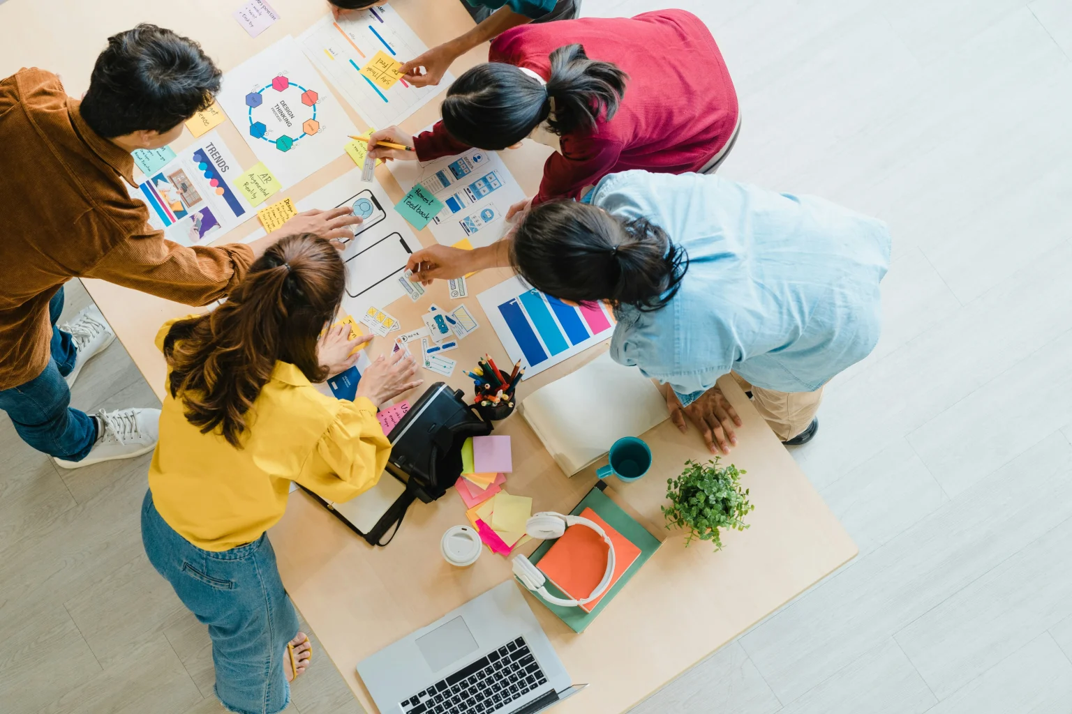 Image of a marketing agency collaborating on strategy at a table